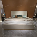 Light Beige Upholstered Bed with Brand Emblem & Gold Stainless Steel Base